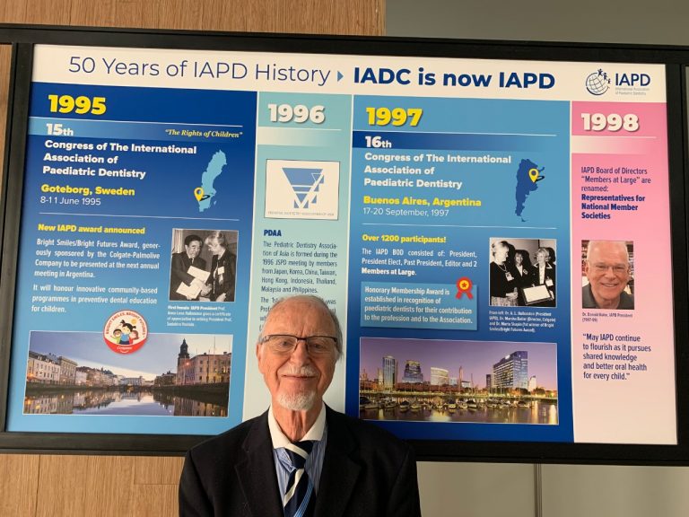 Prof Andreasen in Cancun, Mexico 2019 in front of the IAPD History Wall